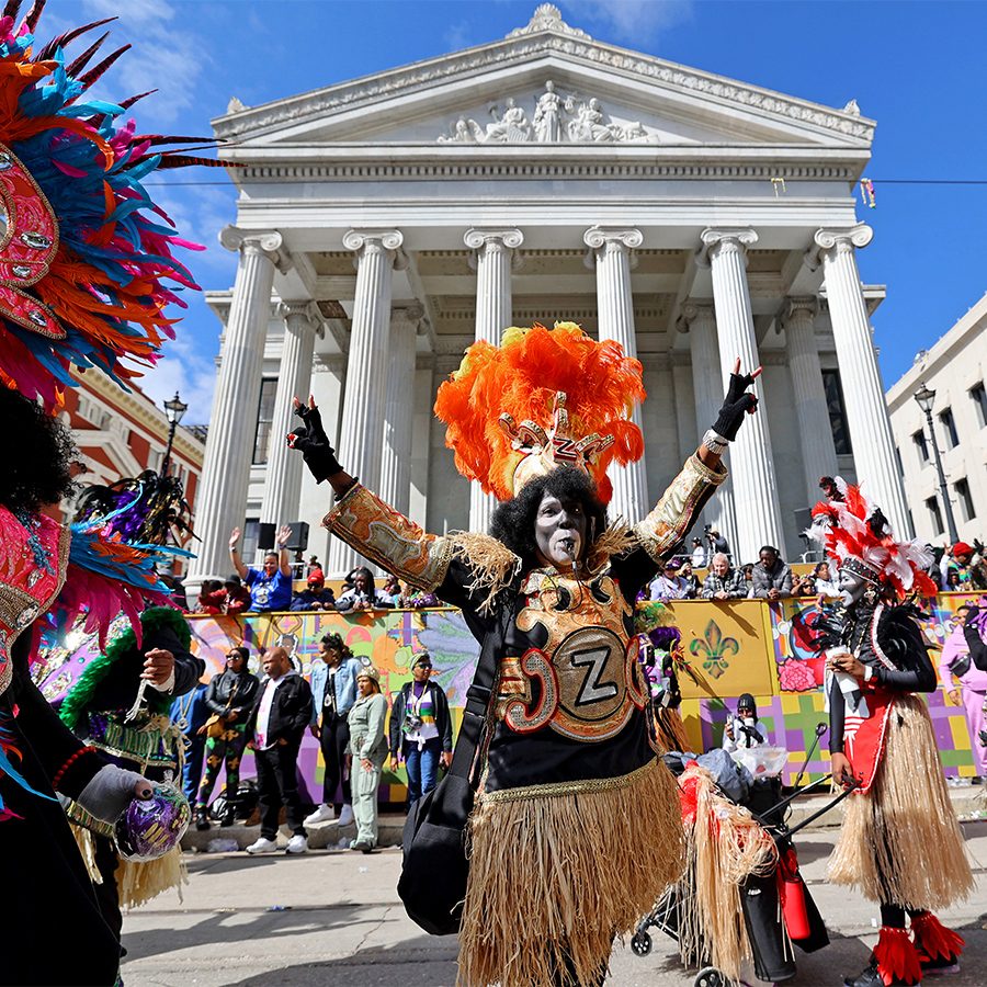 People dressed in costumes celebrate Mardi Gras in New Orleans.